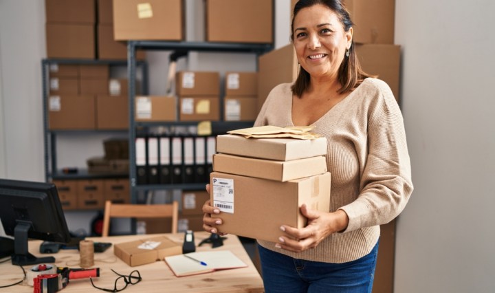 Middle,Age,Hispanic,Woman,Ecommerce,Business,Worker,Holding,Packages,At