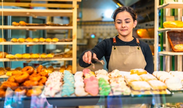 Latin,Young,Woman,Wearing,Apron,Selling,Artisan,Pastries,In,A